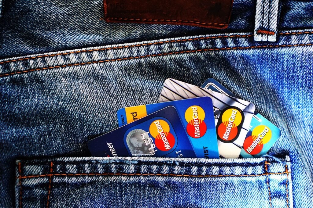 47% of Americans Carry a Credit Card Balance — The 8-Minute Payoff Plan That Actually Works credit cards, denim, jeans, blue jeans, debit cards, cards, money, bank account, bank, mastercard, pocket, credit cards, money, money, money, money, money, bank, bank, bank